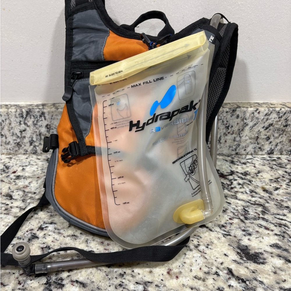 Hydrapak Hydration Backpack Reversible II  1.5 Liters / 50 Oz - Orange/ Gray